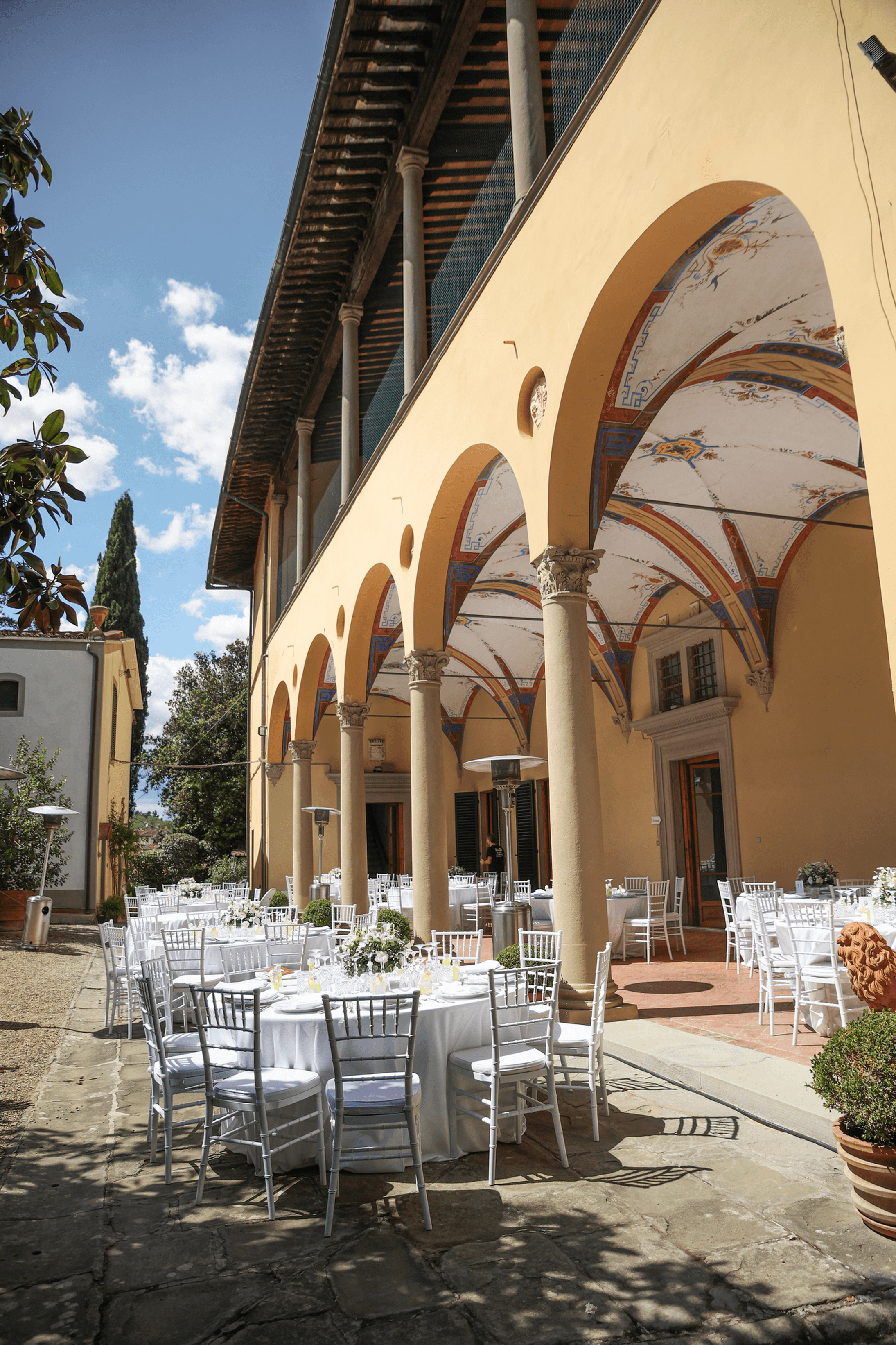 An ancient stone archway in an Italian villa, draped in history.